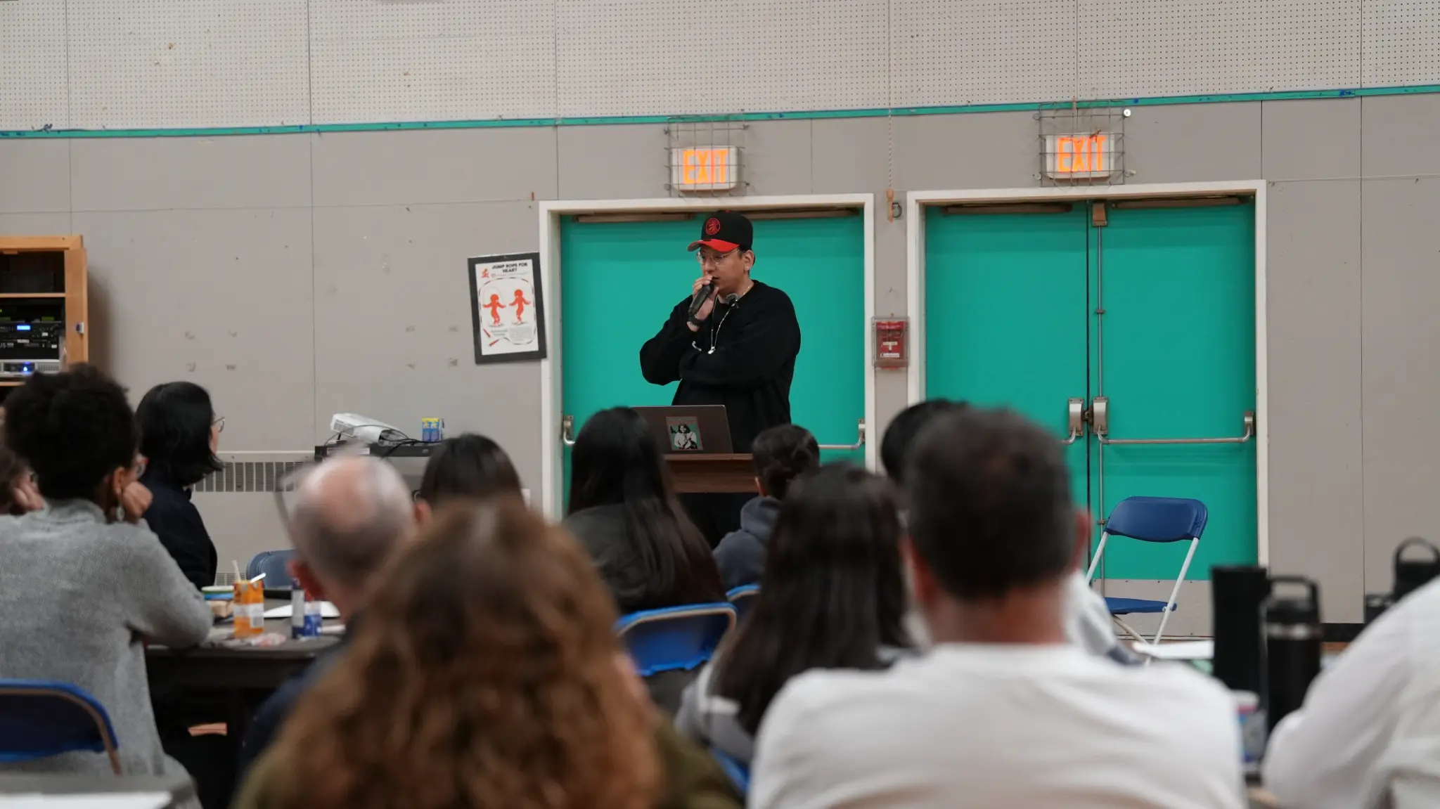 Dakota Bear presenting to engaged educators