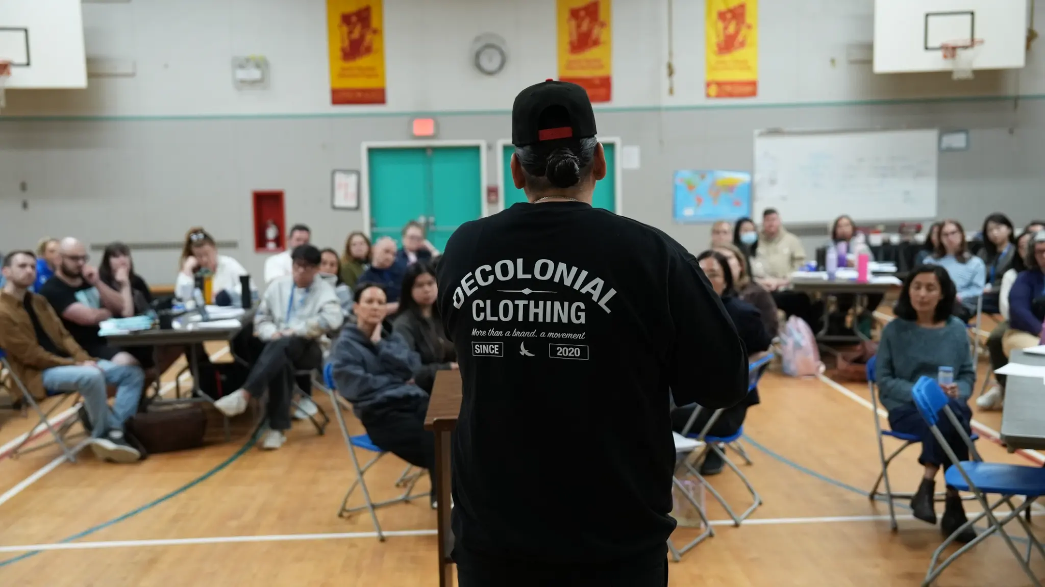 Dakota Bear addressing the room